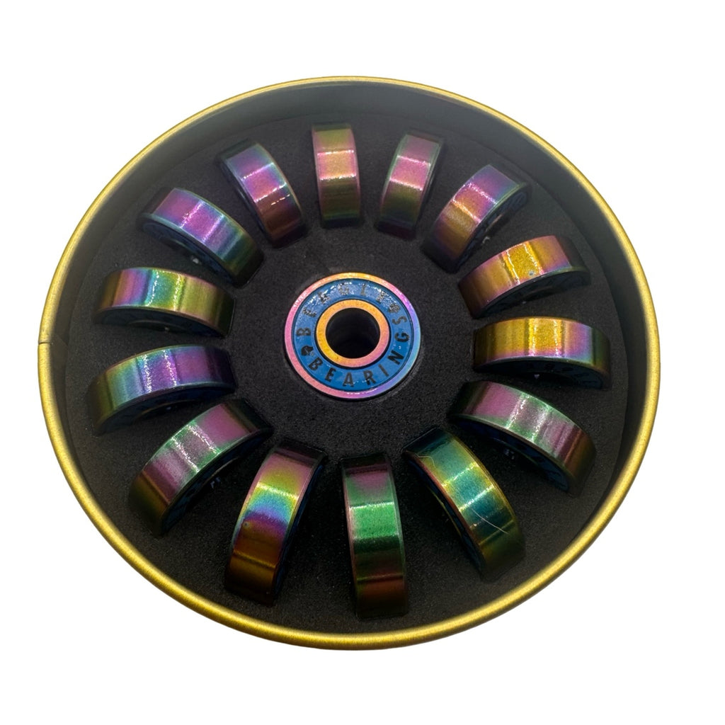 Beagle Bearings Tiko 8mm rainbow bearings displayed in open gold tin packaging